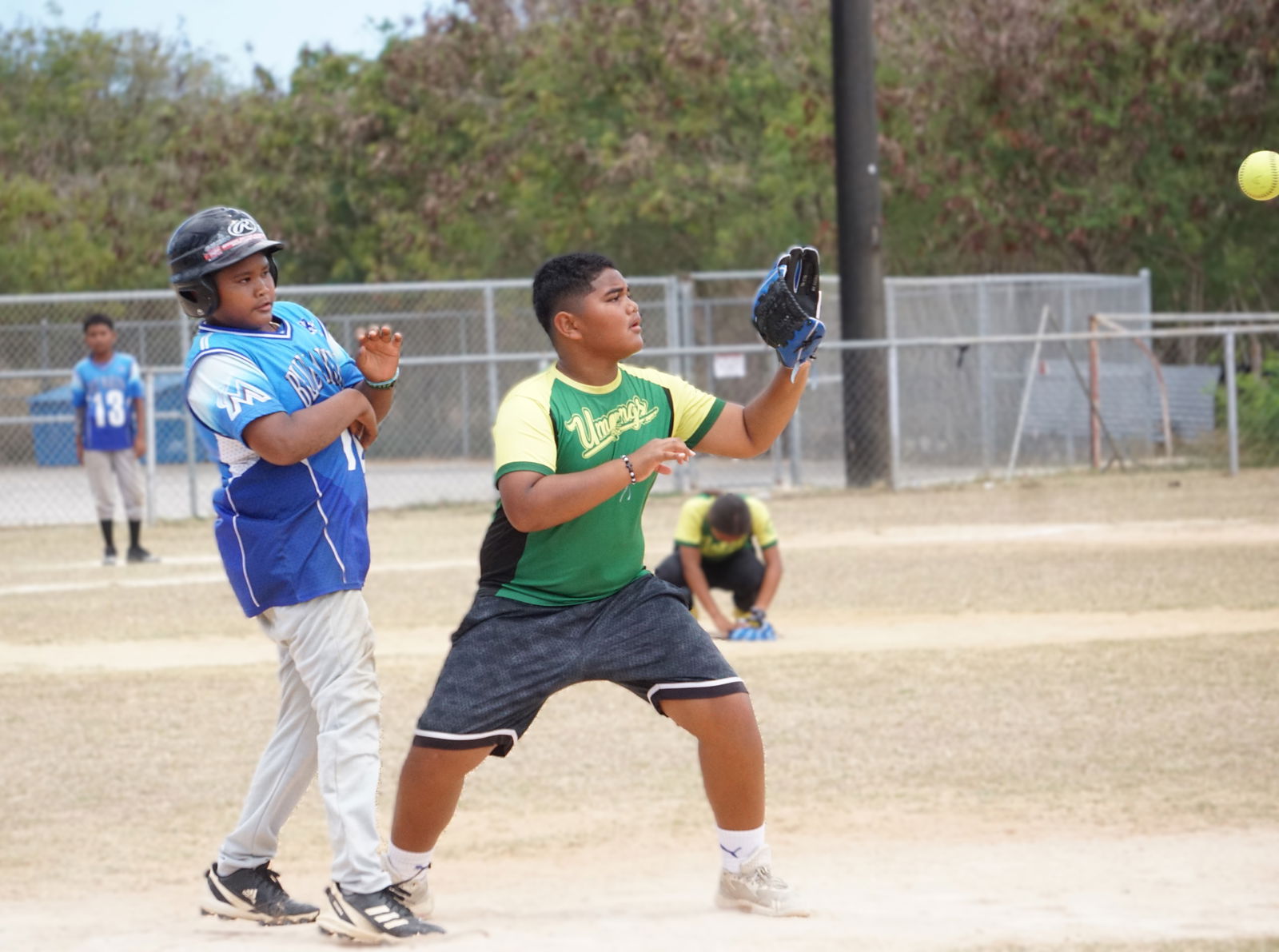 A Kagman Elementary School student beats Koblerville Elementary School's first baseman's attempt at a pickoff during the co-ed elementary school division title match of the PSS-NMISA Interscholastic Softball League SY24-25 at the Dandan softball field.Photo by James F. Sablan Jr.