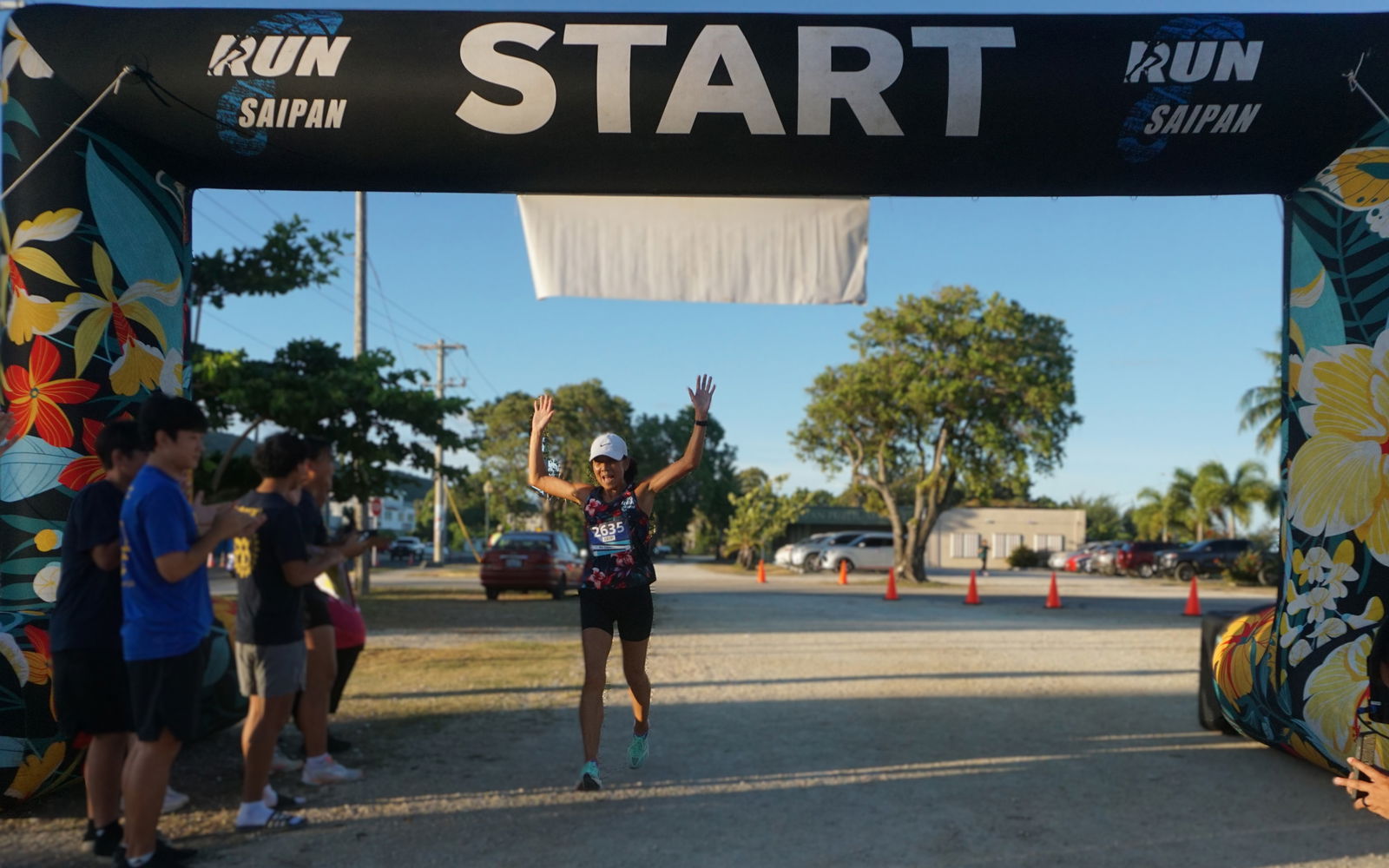 Akiko Miller celebrates as she finishes first overall in the Rotaract Club of Saipan’s 5K Memorial Day Rotaract Fun Run at the Garapan Fishing Base on Saturday morning.Photo by James F. Sablan Jr.