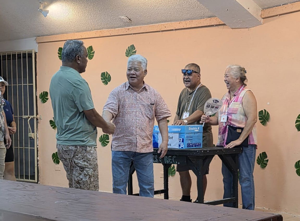 Gov. Arnold I. Palacios shakes hands with outgoing NMI Republican Party President Ramon A. Tebuteb after casting his vote for the new party president at the Garapan Central Park on Thursday.