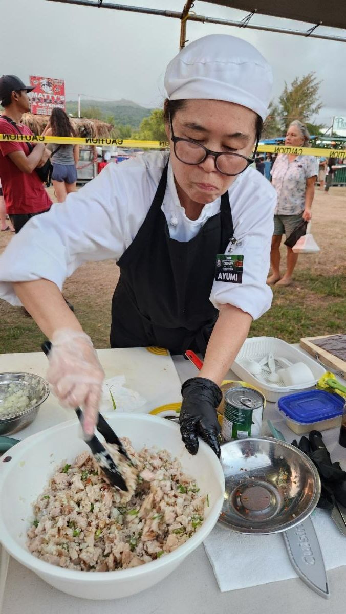 Ayumi Litulumar makes her first-ever chicken kelaguen to win 2nd place in the HANMI-NMTech Chef’s Challenge at the 26th Annual Taste of the Marianas International Food Festival on May 24, 2025, at American Memorial Park.