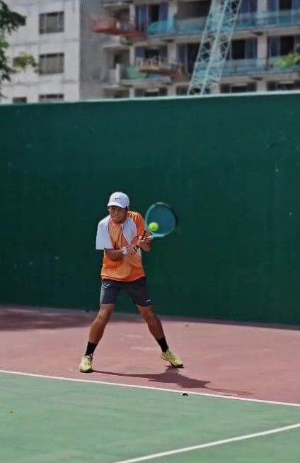 Matt Zhu hits a backhand return during a 16U Boys Doubles match at the PIC 2025 Tennis Championships on Saturday.