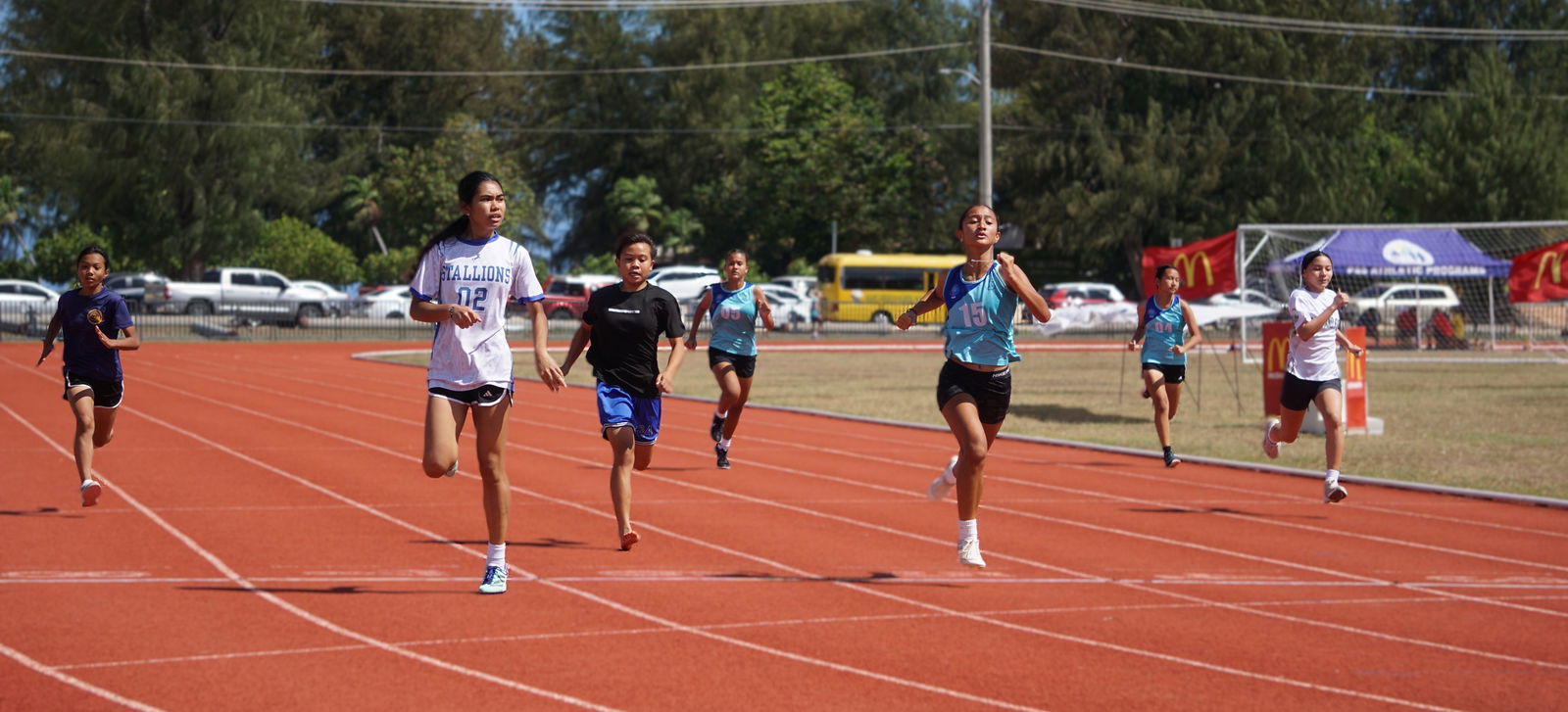 Runners push through the finish line in the girls 14U 400m event of the PSS-McDonald’s All School Track and Field SY24-25 at the Oleai Sports Complex on Saturday.Photo by James F. Sablan Jr.
