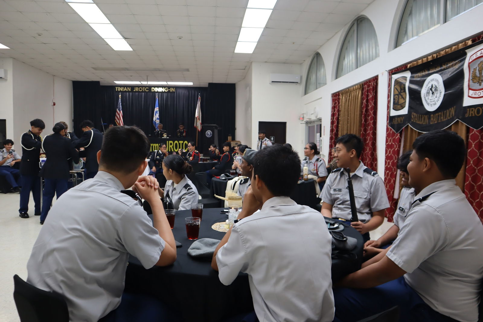 Attendees watch the Punch Bowl skit.Photo by C/PFC MercyAnne Christian