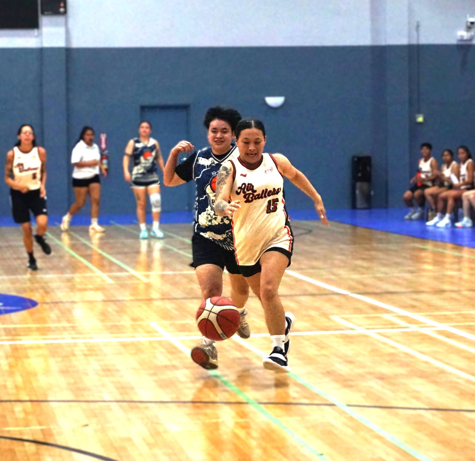 Air Ballers’ Roxanne Duenas dribbles past a defender for a fastbreak opportunity during a Women's Open Division game of the 2025 Allied Pacific Environmental Corporation Basketball League at the Ada gym.Photo by James Sablan