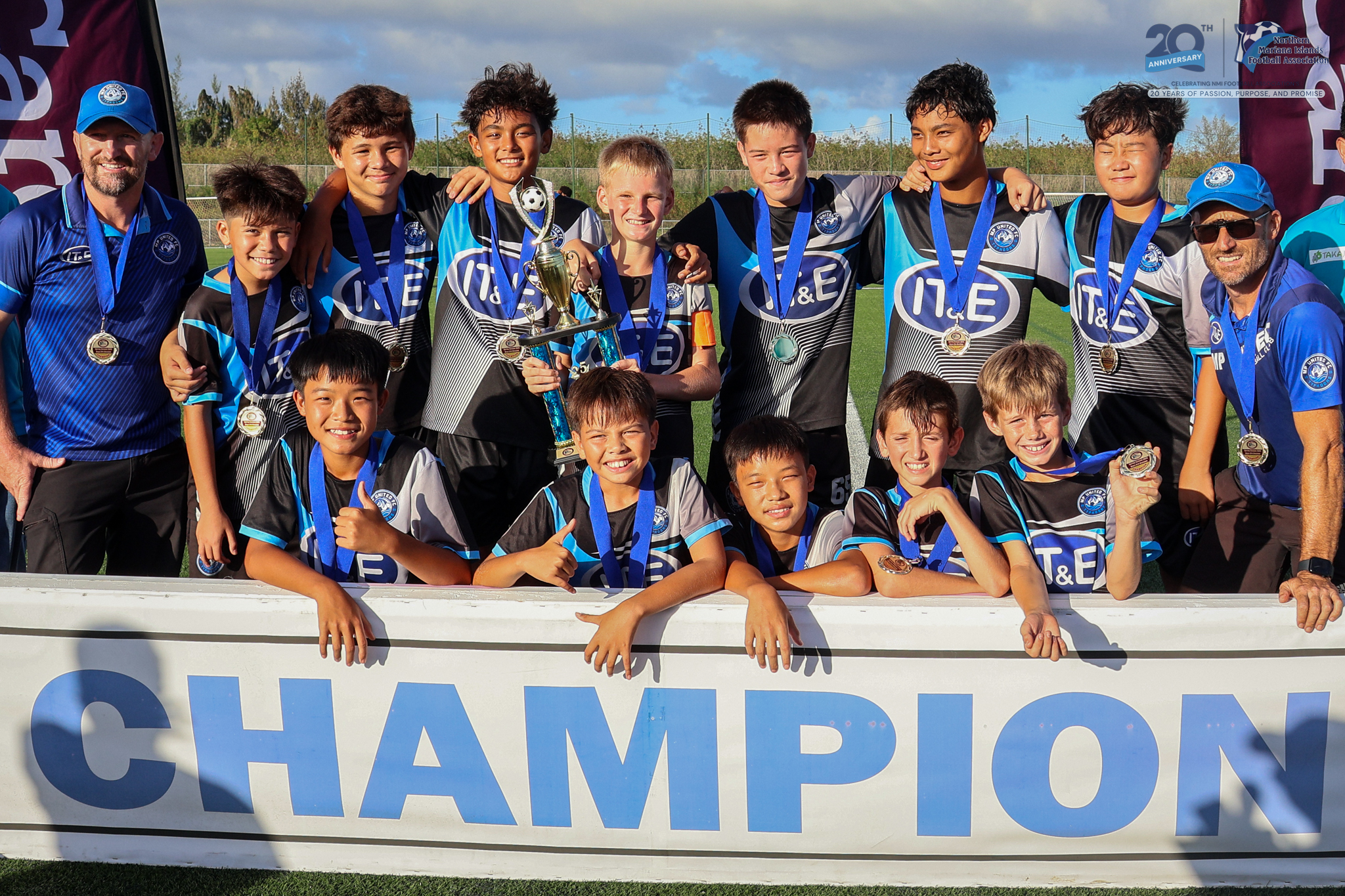 MP United Football Club players pose with the U14 boys division championship trophy during the awards ceremony of the TakeCare Youth Soccer League Spring 2025 at the NMI Soccer Training Center in Koblerville on Saturday.NMIFA photo