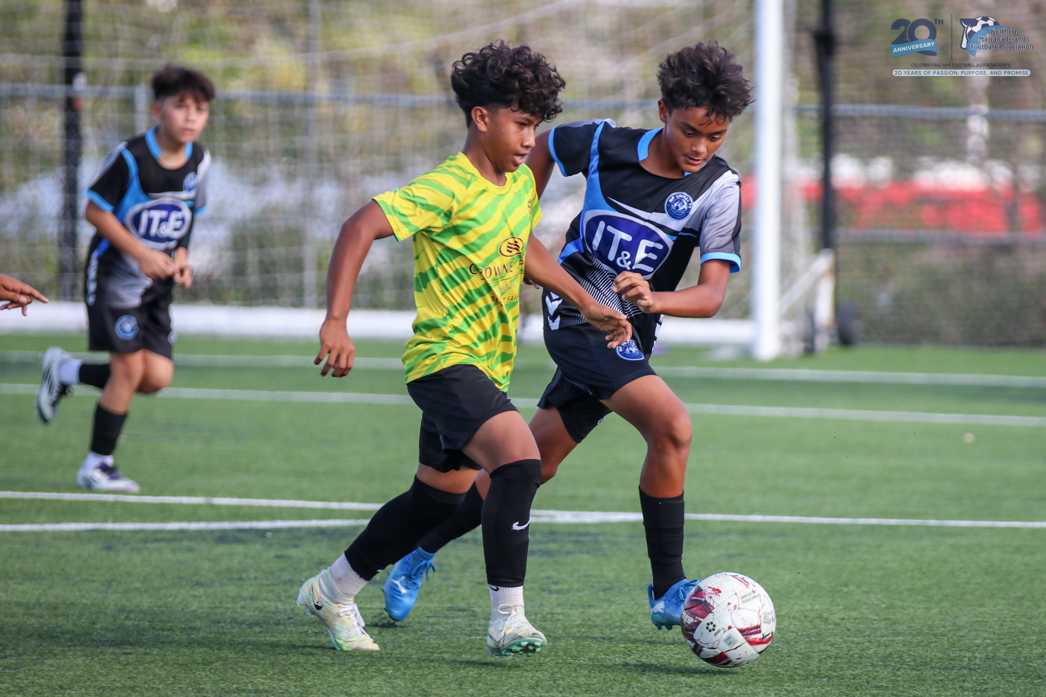 Matansa’s Brandon Teigita and MP United’s Kanoa Owens race after the loose ball during the U17 boys division title match of the TakeCare Youth Soccer League Spring 2025 at the NMI Soccer Training Center in Koblerville on Saturday.NMIFA photo