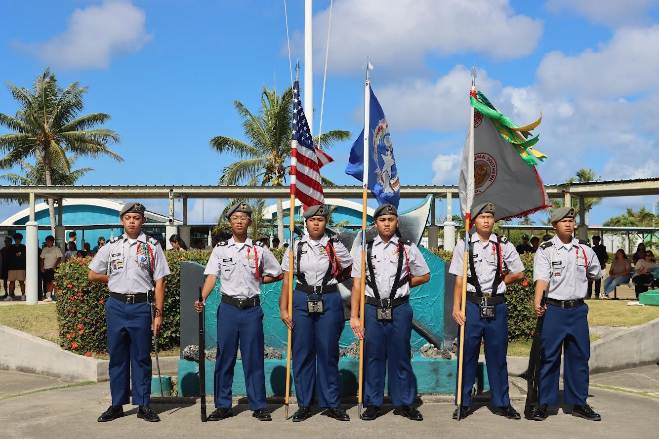 Outgoing battalion C/CSM Eman Barce, left, commands the Manta Ray Battalion Color Guard.
