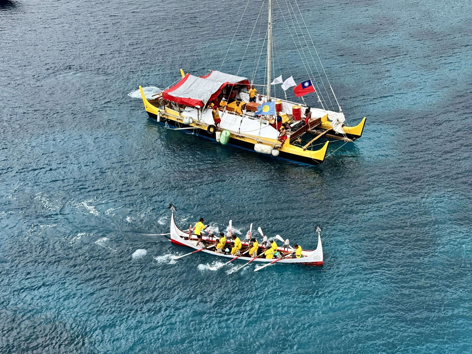 The Alingano Maisu is greeted by members of the Hongtou and Yayou tribes with a ceremonial paddle relay in Lanyu, Taiwan.
