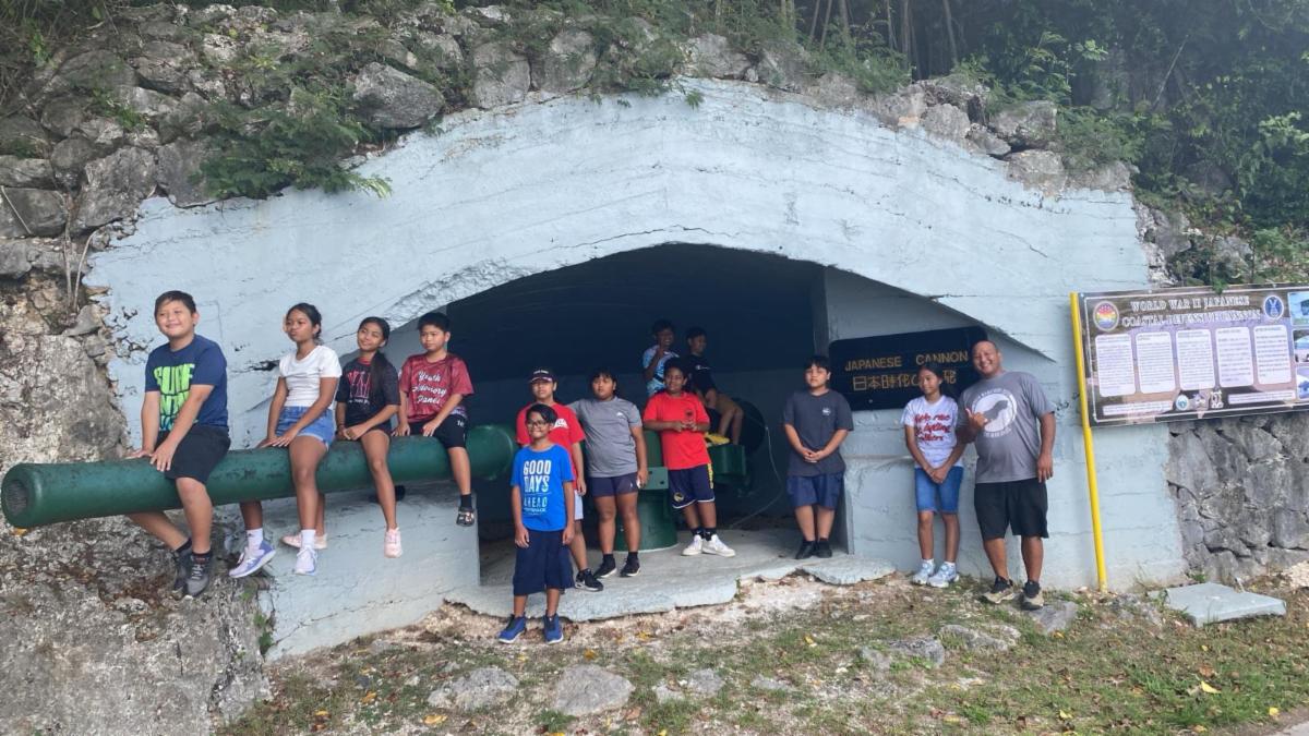 Students of Sinapalo Elementary School visit the World War II Japanese canon site in Rota, The Marianas, on May 17, 2025, as part of the Marianas Visitors Authority’s “Tourists for a Day” familiarization tour for the school’s MY WAVE Club and Student Council. Other sites visited include As Nieves Latte Stone Quarry, Chenchon Bird Sanctuary, and the WWII Japanese Last Command Post, followed by a meal at local eatery Pizzaria to complete the visitor experience.