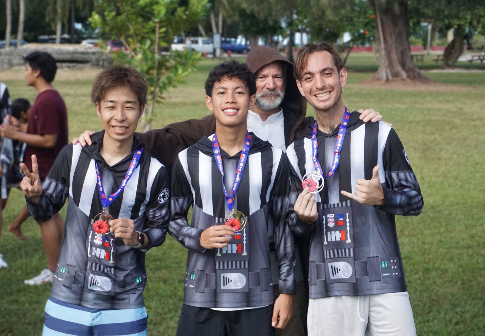 Victor Nash Santos, 2nd left, Jordan Ruiz and Jun Kawano are the top three finishers in the male division of Run Saipan NMI Star Wars Day Run 2025 “May The 4th Be With You” event at American Memorial Park on Sunday. Also in photo: Dr. Ron Snyder, Run Saipan board member.