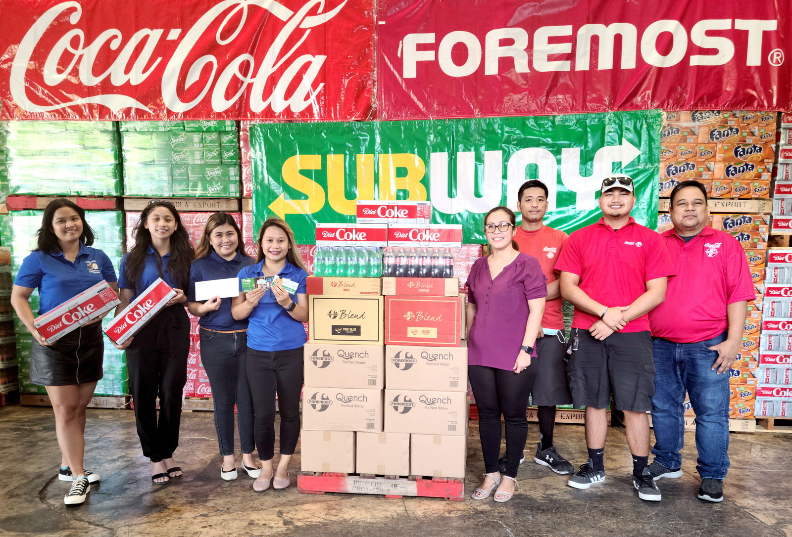 Coca-Cola Saipan assistant operations manager Ailene Benavidez, assistant warehouse supervisor Bernard Estoque, staff member Edward Reyes and warehouse supervisor Marlon Regaton pose for a photo with Marianas Variety sales representatives Hazel Sadian, Monique Mascarinas, Gwendolyn Sandig and Diane Lumapas during a presentation of Coca-Cola’s refreshment donations for the MV Founder's Memorial Golf Tournament set for Saturday, April 2 at 6 a.m., LaoLao Bay Golf & Resort, West Course. The event aims to raise funds for the charitable organization Karidat.