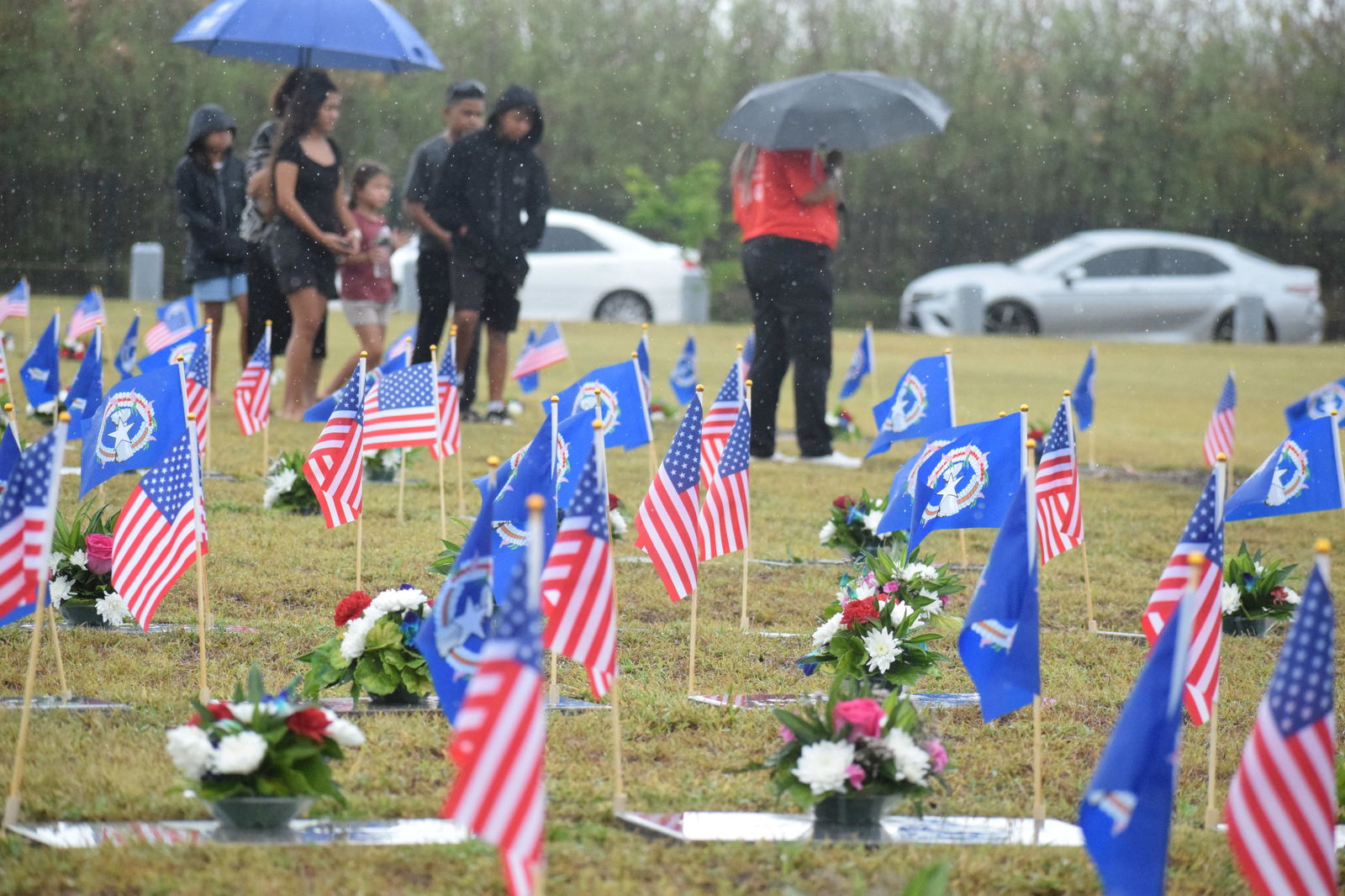 Family members visit the graves of the CNMI’s fallen heroes at the Veterans Cemetery in Marpi on a rainy Memorial Day, Monday, May 26, 2025. Photo by Emmanuel T. Erediano