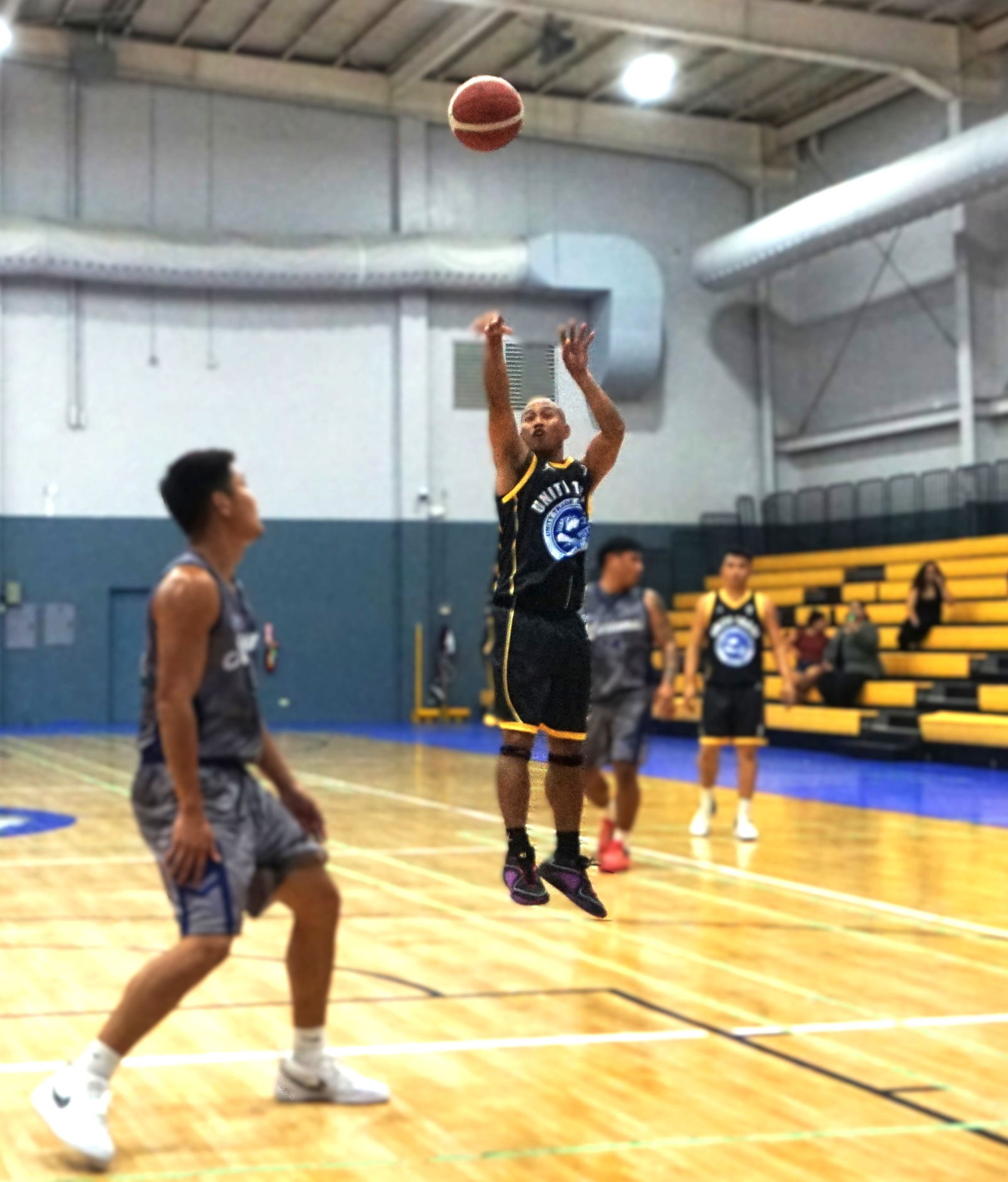 Unity Trade’s Elmer Esdrelon takes an open three-point shot during a Michelob Ultra Cup game at the Ada gym.Photo by James F. Sablan Jr.