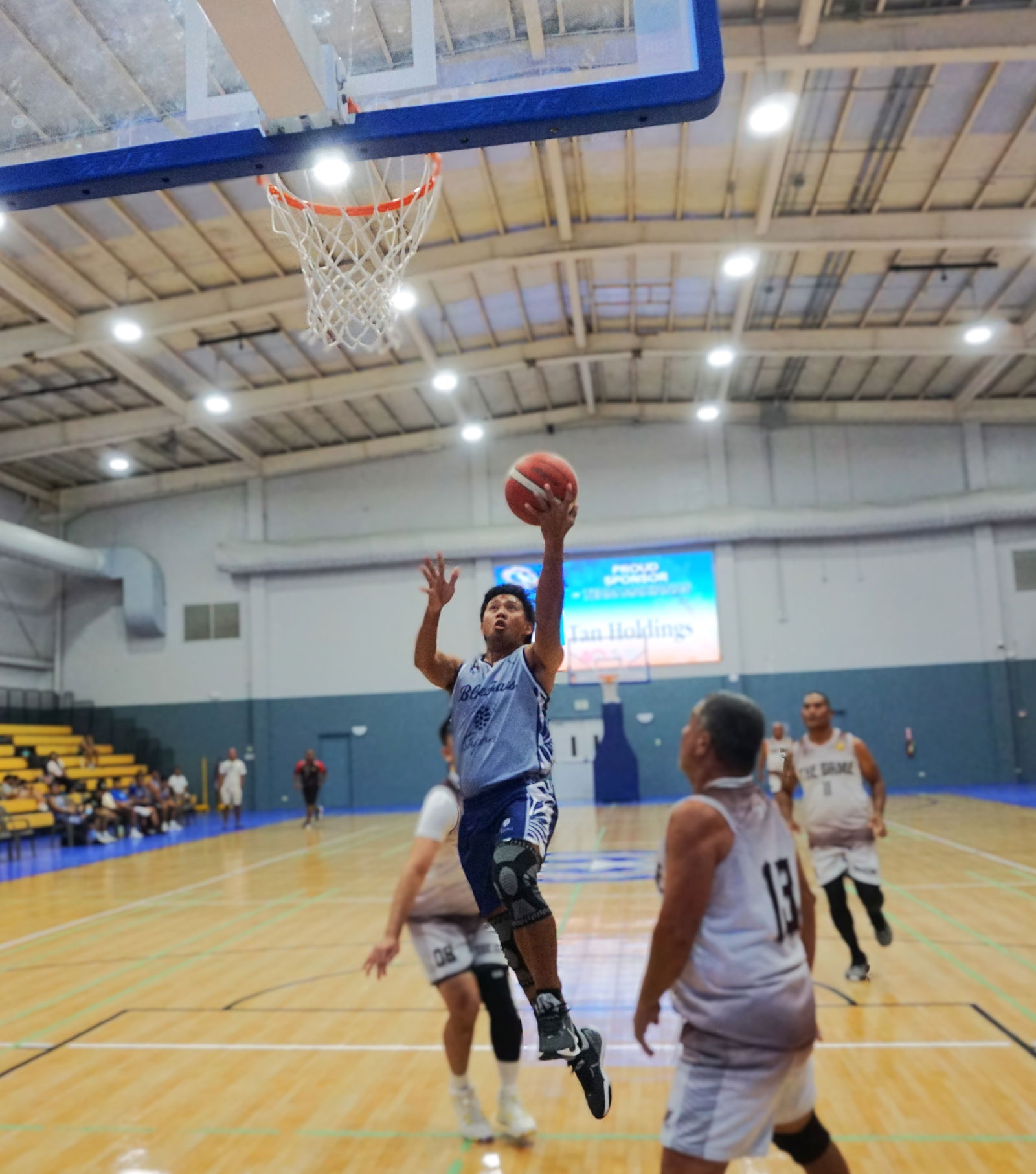 Blue Haus’ JR Barrios rises for a left-handed finish during a game in the masters division of the 2025 IT&E United Filipino Organization Basketball League at Ada Gym.Photo by James F. Sablan Jr.