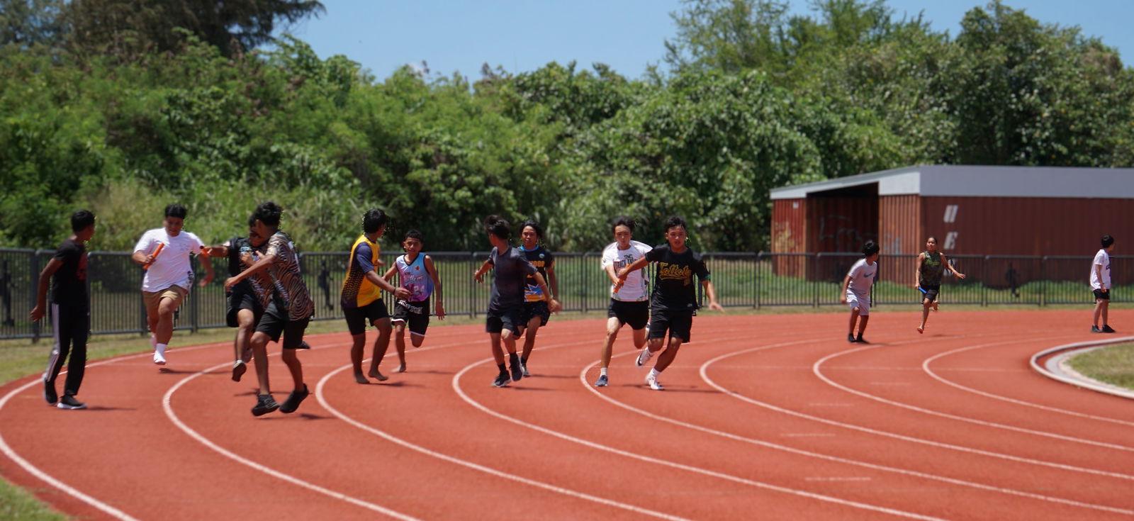 The competitors reach out to hand their batons to their respective teammates in the boys 14U 4x100M finals event of the PSS-McDonald's All Schools Track and Field SY24-25 championships at the Oleai Sports Complex on Saturday.Photo by James F. Sablan Jr.