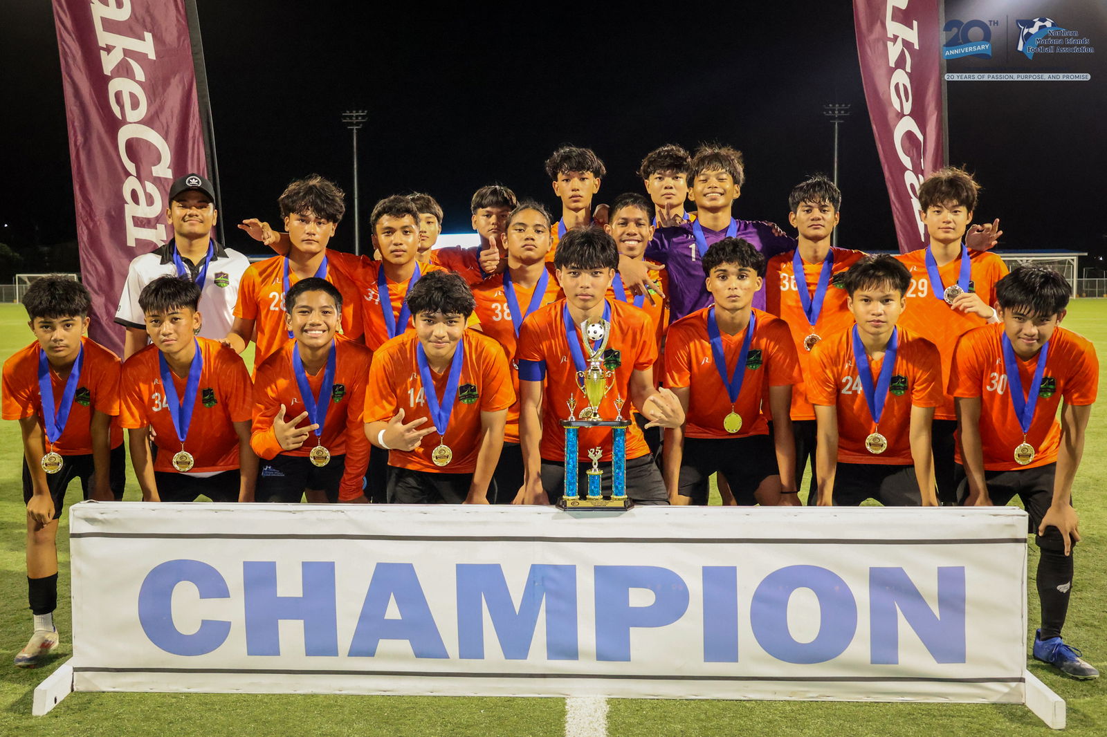 Kanoa Football Club players pose with the U17 boys division championship trophy during the awards ceremony of the TakeCare Youth Soccer League Spring 2025 on Saturday at the NMI Soccer Training Center in Koblerville.NMIFA photo