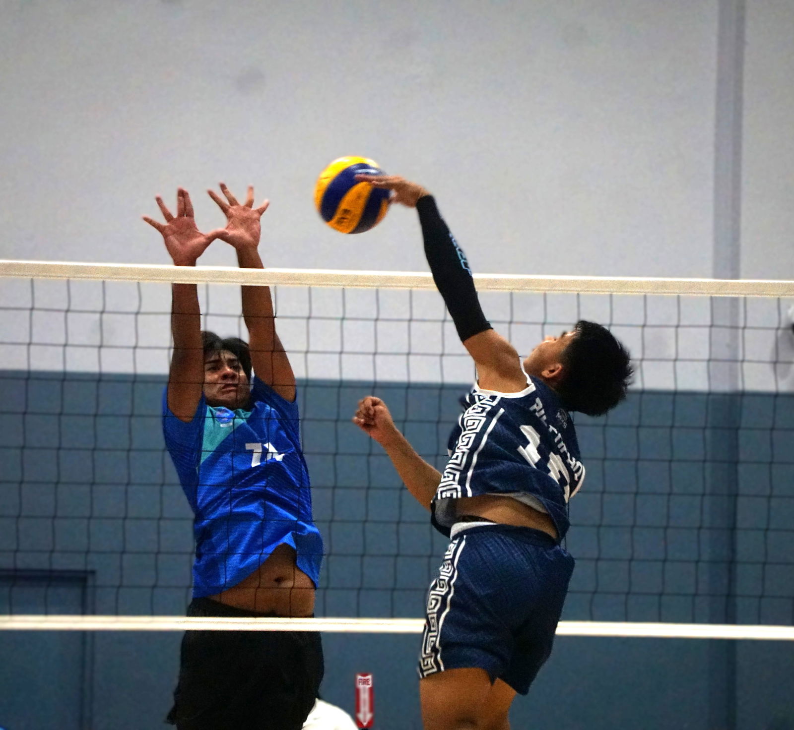 SIS’ Joab reaches out for a block attempt against MHS in the boys high school division title match of the PSS-NMIVA Interscholastic Volleyball League SY24–25 at the Ada gym on Saturday.Photo by James F. Sablan Jr.