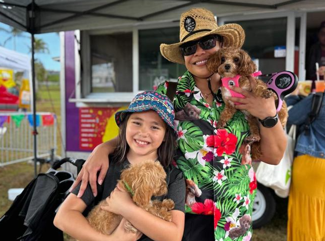 Lalani Aguon and her family enjoy Pet Fest Guam 2025 with pets Canela and Ina on Saturday, May 3, 2025 at Gov. Joseph Flores Park at Ypao Beach in Tumon.Photos by Jolene Toves/The Guam Daily Post