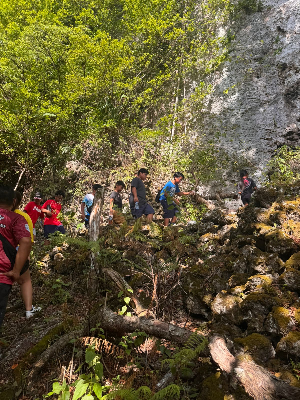Students of Sinapalo Elementary School hike to the World War II Japanese Last Command Post in Rota, The Marianas, on May 17, 2025, as part of the Marianas Visitors Authority’s “Tourists for a Day” familiarization tour for the school’s MY WAVE Club and Student Council. Other sites visited include As Nieves Latte Stone Quarry, Chenchon Bird Sanctuary, and the WWII Japanese Canon, followed by a meal at local eatery Pizzaria to complete the visitor experience.