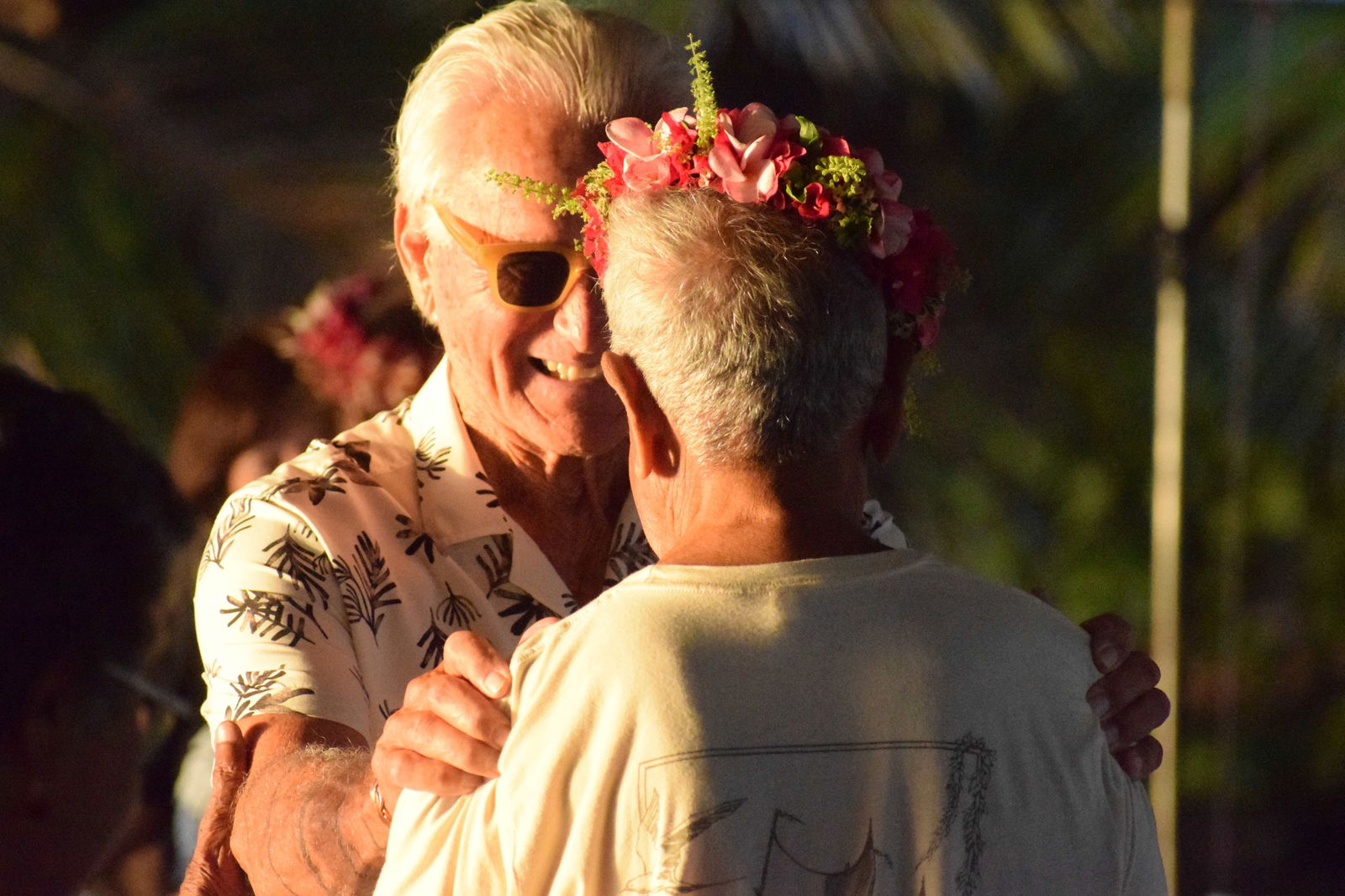 Former Peace Corps volunteer Al Inu greets Lino Olopai.