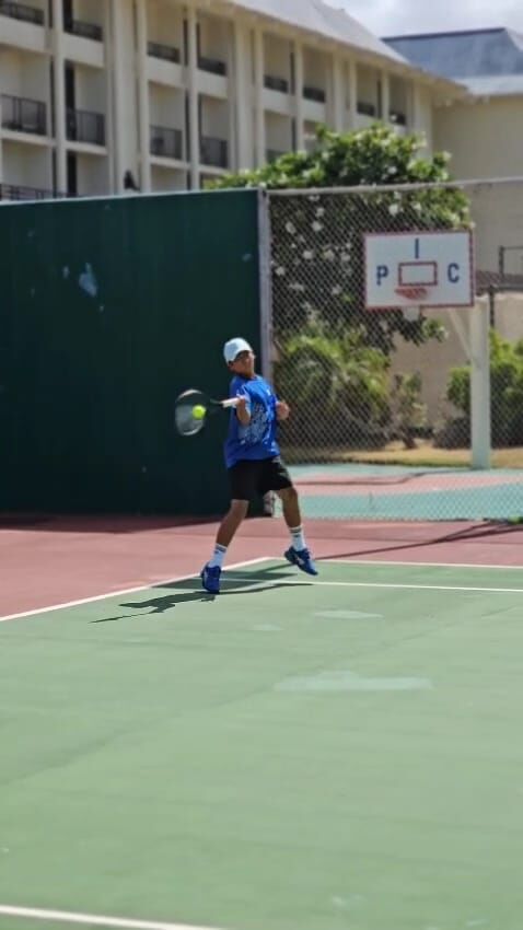 Daniel Kang attempts a front hand return during a Singles 14U Boys Division match of the PIC Saipan 2025 Tennis Championships, which were held at PIC Saipan over the weekend.