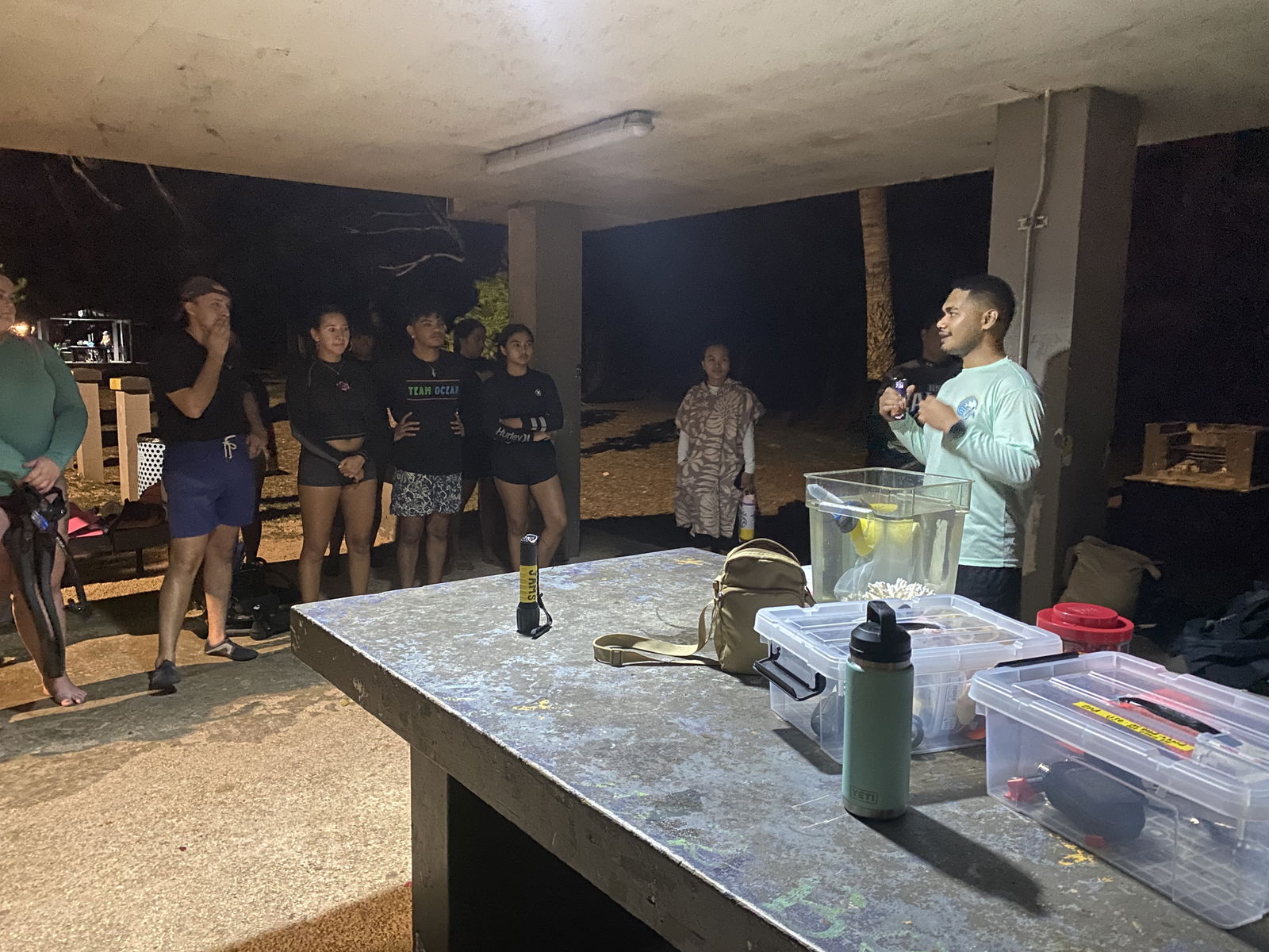 Joe Nekaifes speaks about corals ahead of the night swim to gather coral spawn.