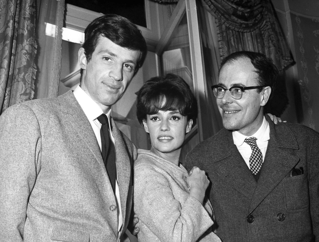 From left, actors Jean Paul Belmondo, Jeanne Moreau and director Marcel Ophuls pose on the set of “Banana Skin-Peau de Banane,” Feb. 26, 1963 at Billancourt studioes near Paris.AP