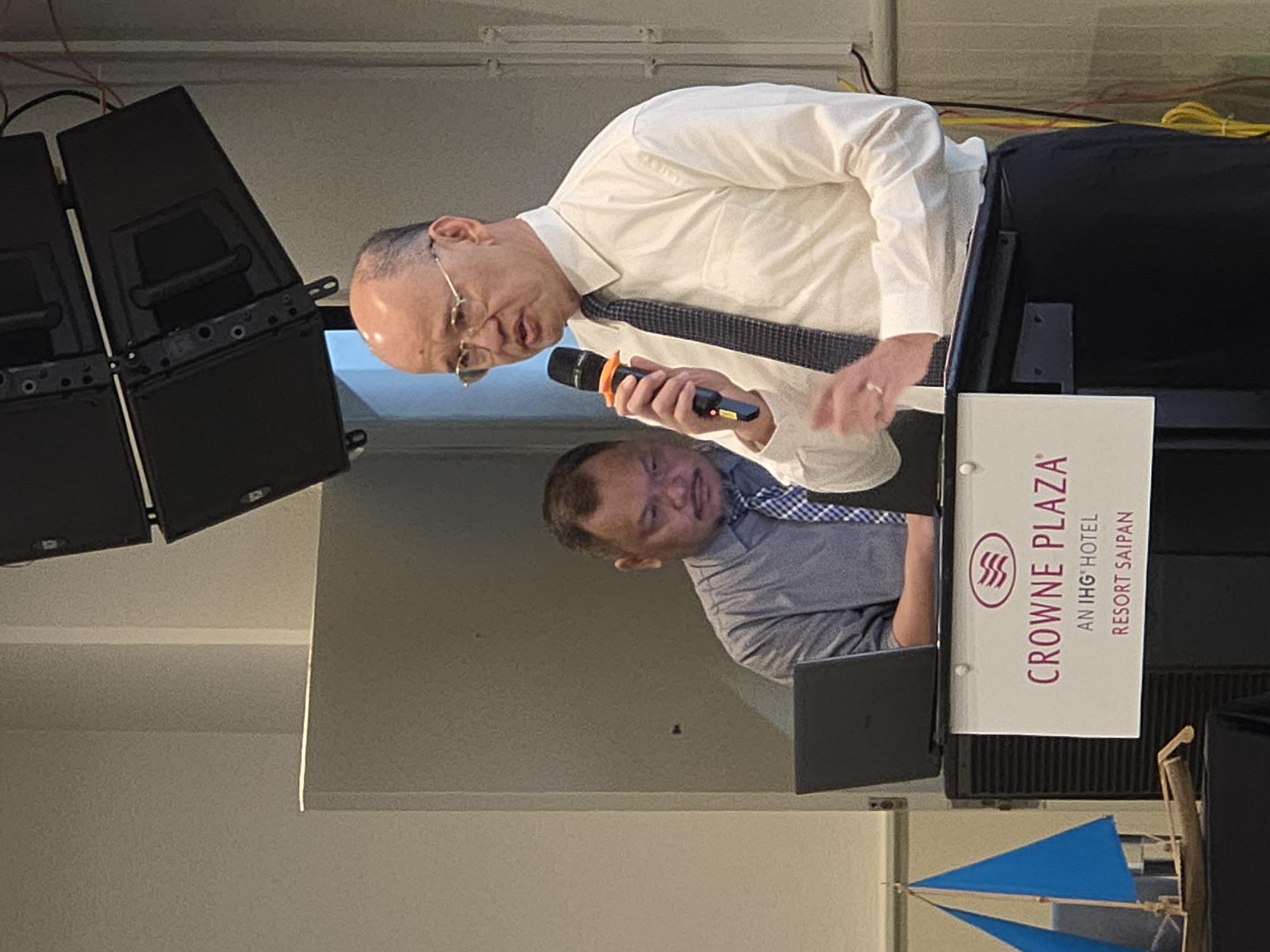 Justice John Manglona delivers his remarks with Edward Diaz, drug court manager, seen in the background.