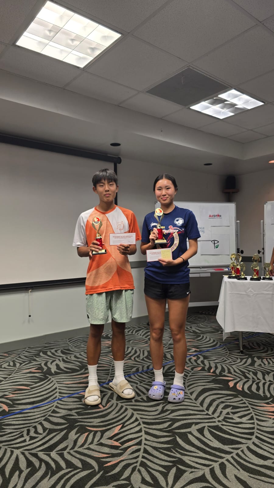 Siwoo Lee and Irin Chung pose with the Doubles Mixed Open trophies during the awards ceremony of the PIC 2025 Tennis Championships at PIC.