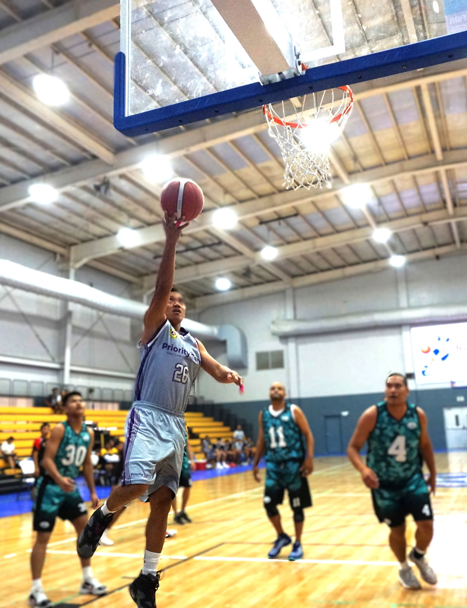 Priority Care's Emmanuel Bondad extends for the uncontested finish during a semifinal game against A+ Consulting in the Open Division of the 2025 IT&E United Filipino Organization Basketball League at the Ada gym on Sunday.Photo by James F. Sablan Jr.