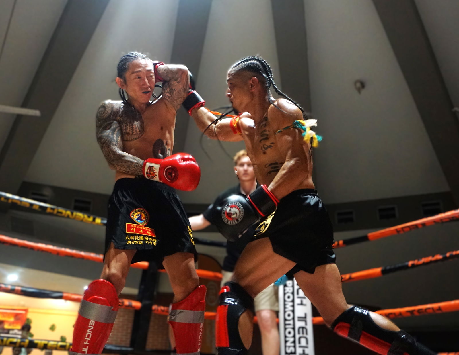 Ram Lee blocks a hook from Josh Mesa during the semi-main event of Ring of Fire 3 at the Garapan Round House on Saturday night.Photo by James F. Sablan Jr.