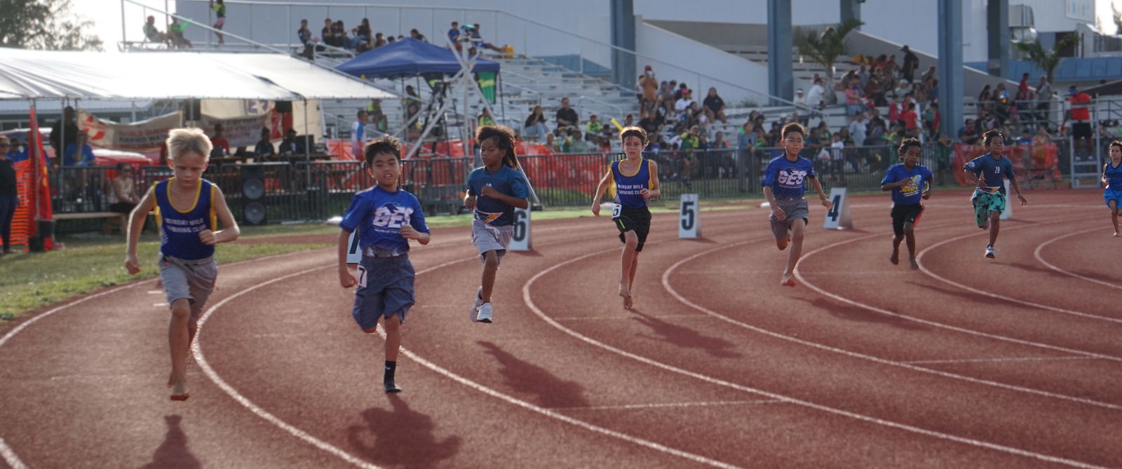Participants complete their first lap during the boys 12U 800m event of the PSS-McDonald’s All School Track and Field SY24-25 at the Oleai Sports Complex on Saturday.Photo by James F. Sablan Jr.