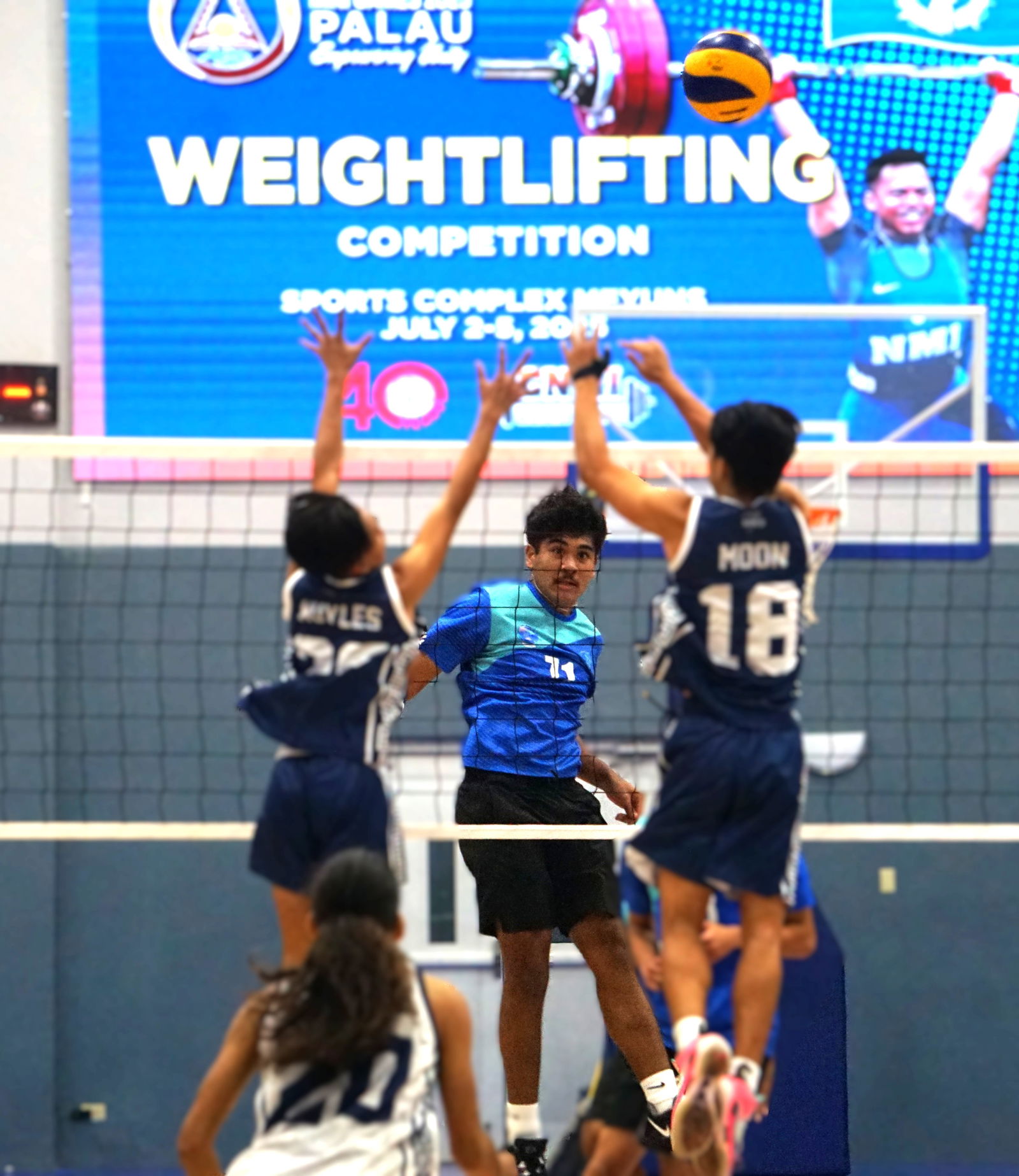 SIS’ Joab looks on after sending the ball over two MHS defenders.