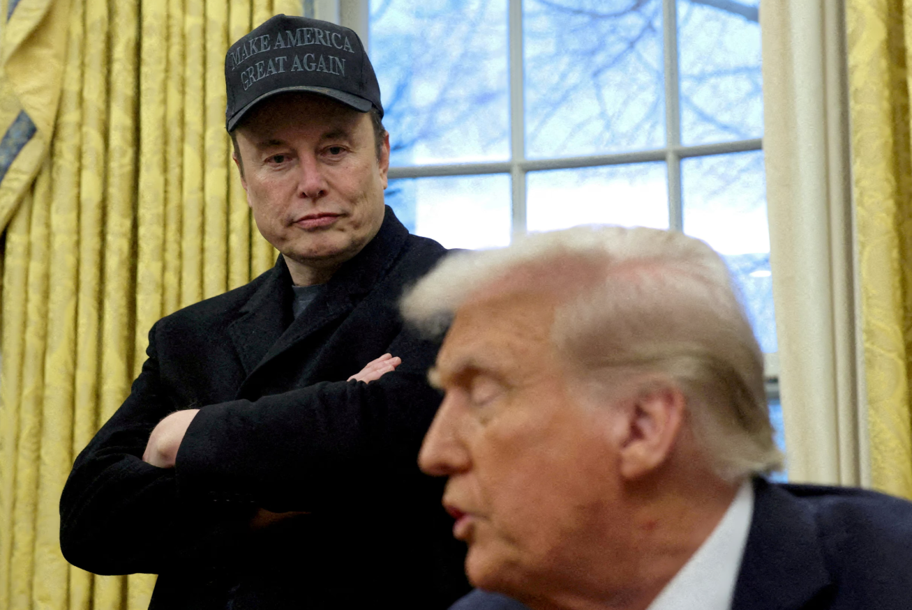 Elon Musk listens to President Donald Trump speak in the Oval Office of the White House in Washington, D.C., Feb. 11, 2025.REUTERS