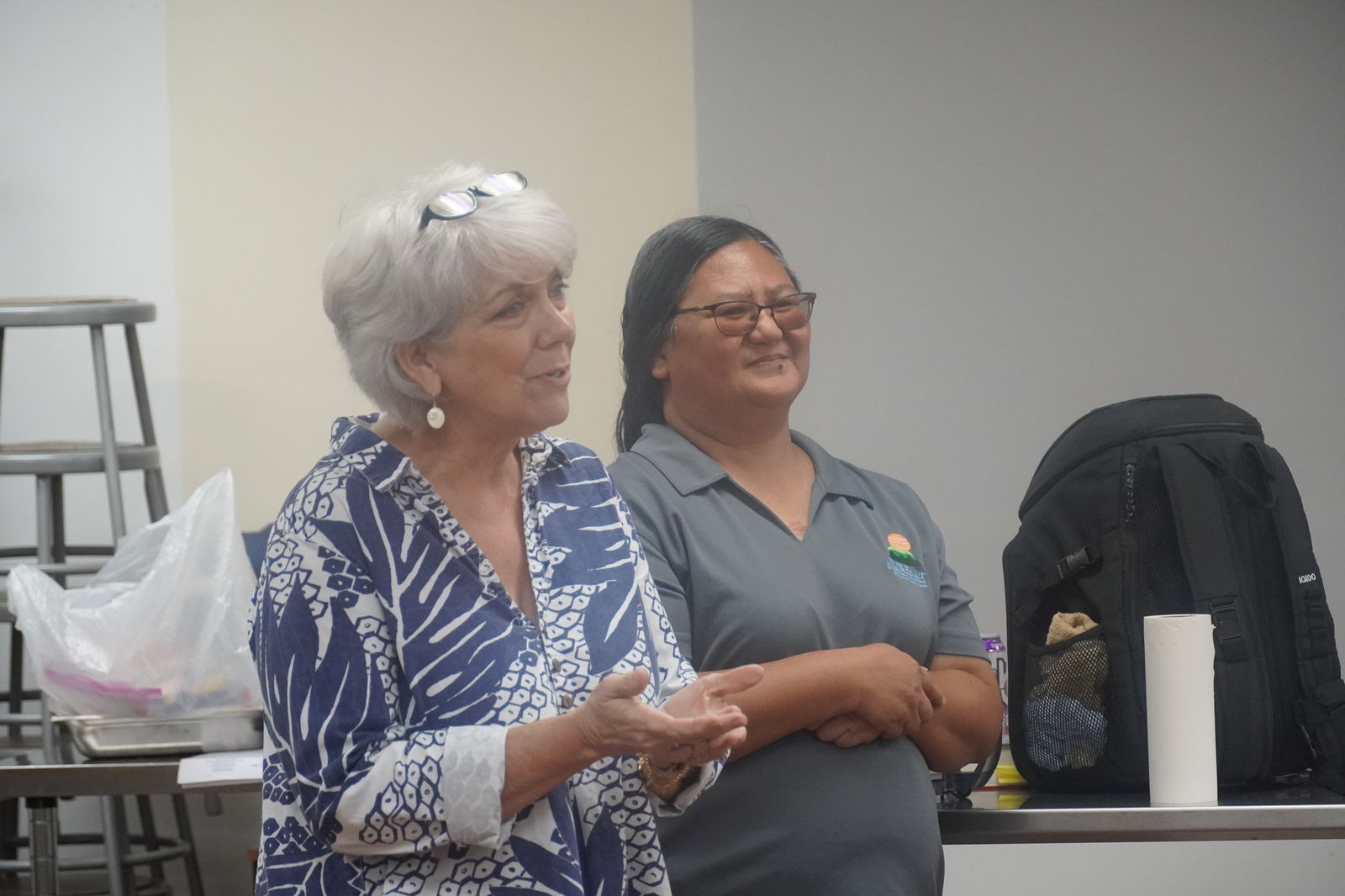 Karidat executive director and Guma Esperansa manager Lauri Ogumoro, left, expresses her gratitude to NMTech for the Thanksgiving meal.