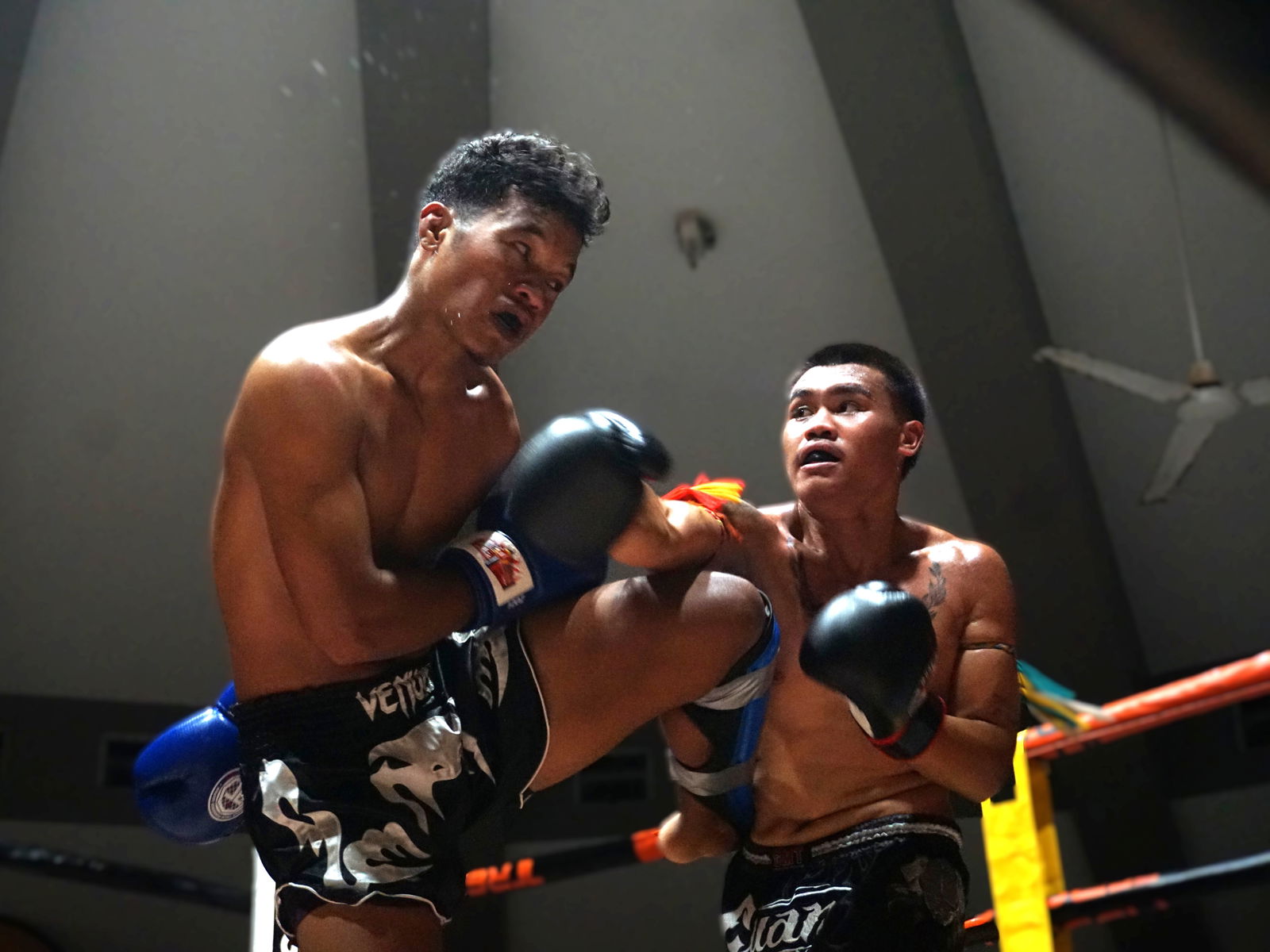 Harry Wells lands a straight punch against Teipo Asep during the main event of Ring of Fire 3 at the Garapan Round House on Saturday night.Photo by James F. Sablan Jr.