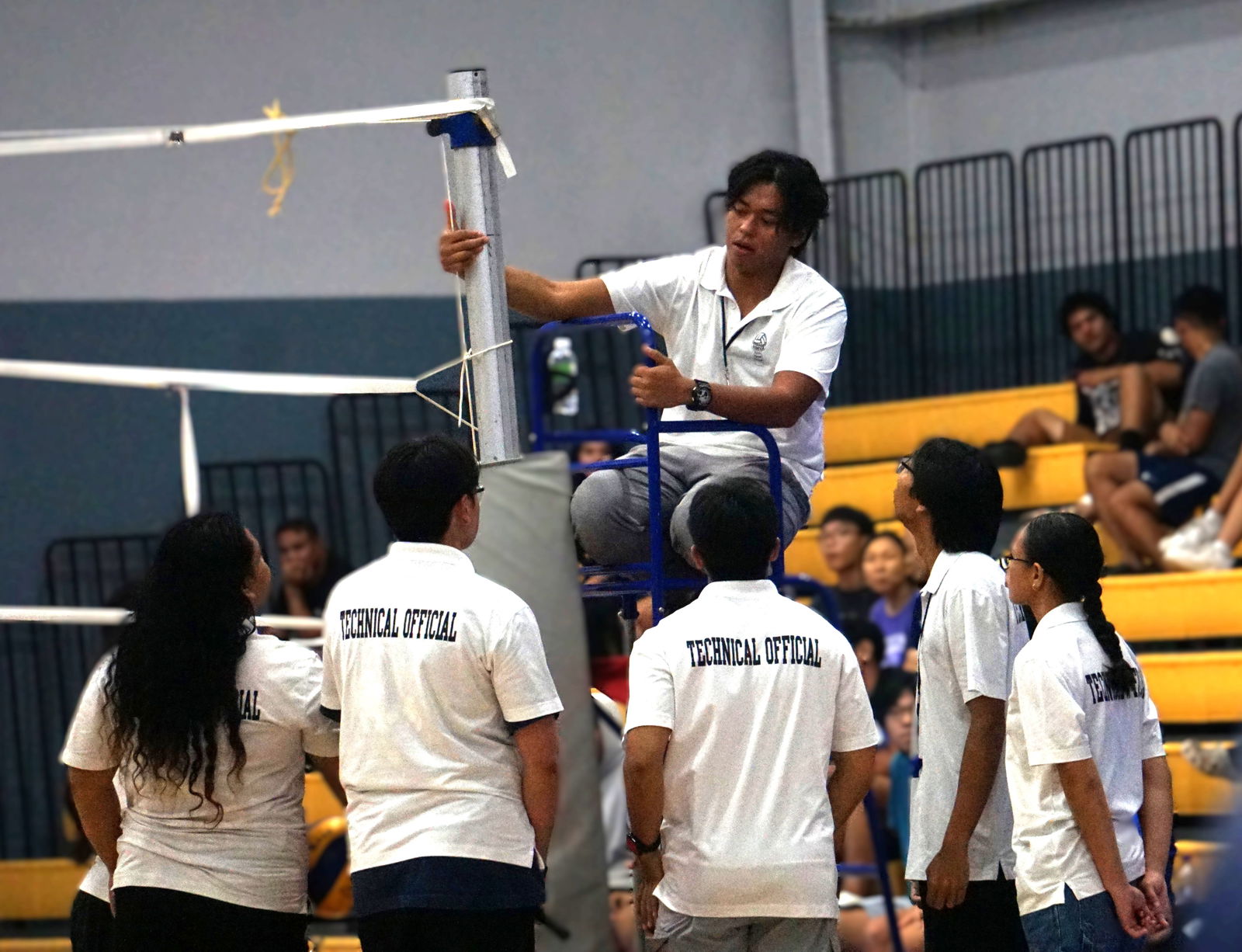 The technical officials huddle for a discussion.