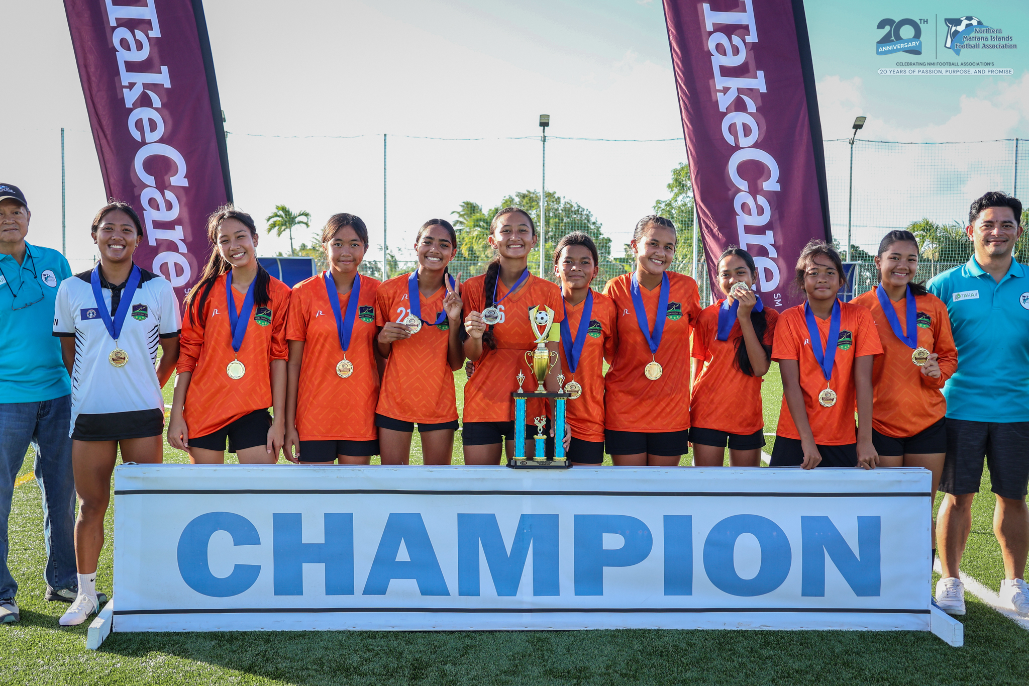 Kanoa Football Club players pose with the U14 girls division championship trophy during the awards ceremony of the TakeCare Youth Soccer League Spring 2025 at the NMI Soccer Training Center in Koblerville on Saturday.NMIFA photo