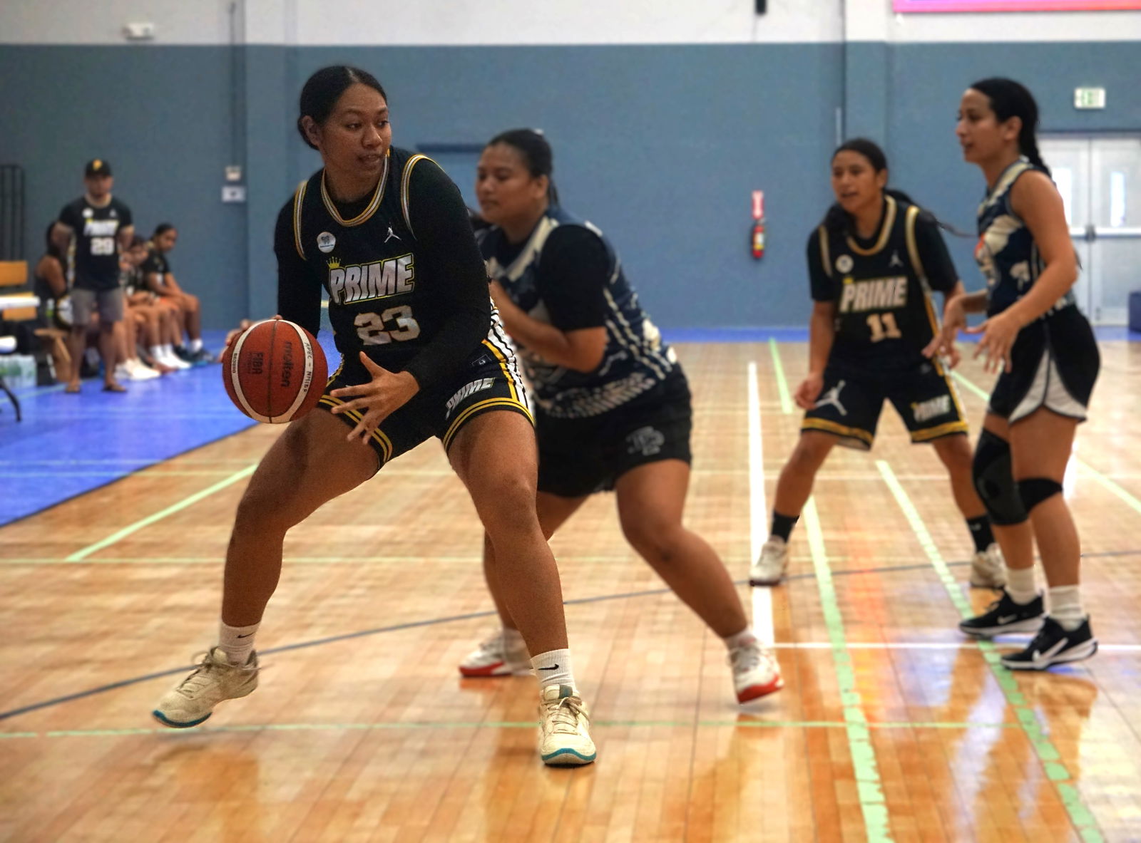 Prime's Azriel Fatialofa backs down a defender during a game against Hericanes in the women's division of the 2025 Allied Pacific Environmental Corporation Basketball League at the Ada gym on Saturday.Photo by James F. Sablan Jr.