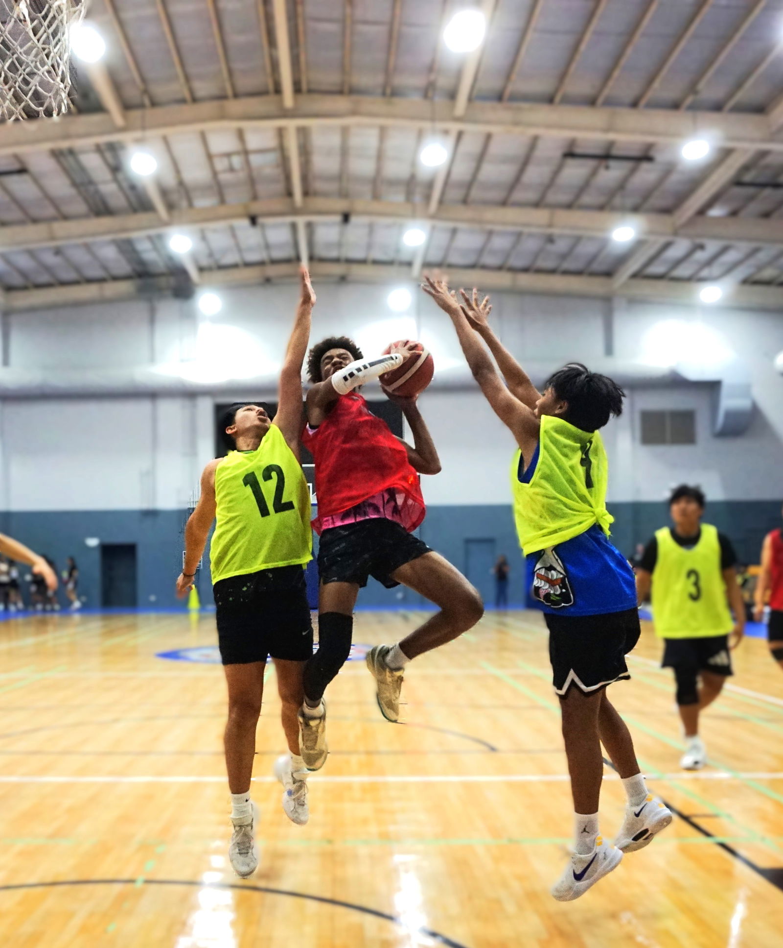 Hardt Eye defenders swarm a shooter during a U18 boys division game in the 2025 Allied Pacific Environmental Consulting Basketball League at Ada Gym.Photo by James F. Sablan Jr. 