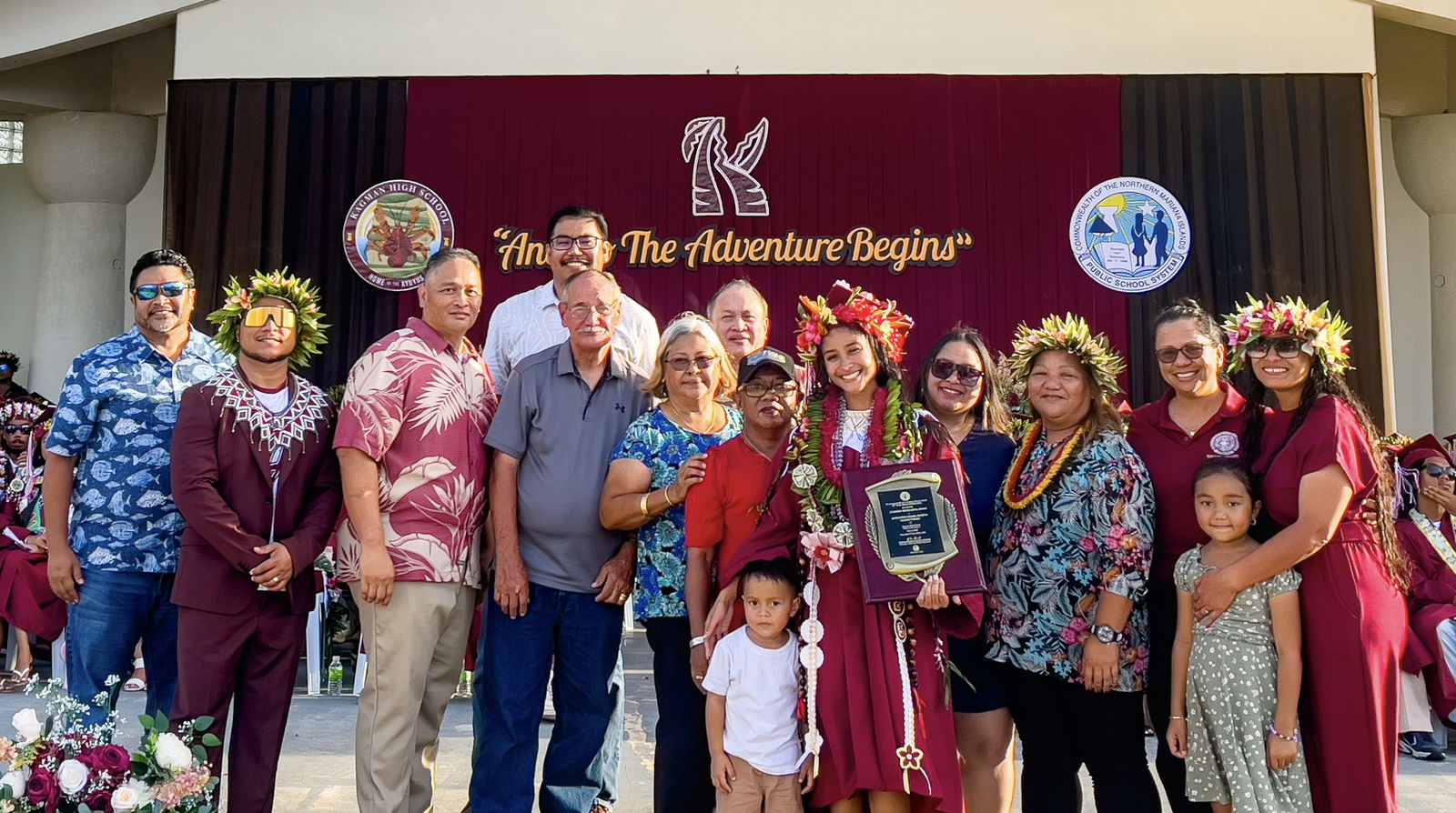Valedictorian Jayda Isis Lizama Norita poses for a photo with her family after receiving the Board of Education Academic Excellence Award from BOE Chairman Aschumar Kodep Ogumoro-Ulodong, Secretary/Treasury Anthony L. Borja, BOE members Andrew L. Orsini and Maisie B. Tenorio.