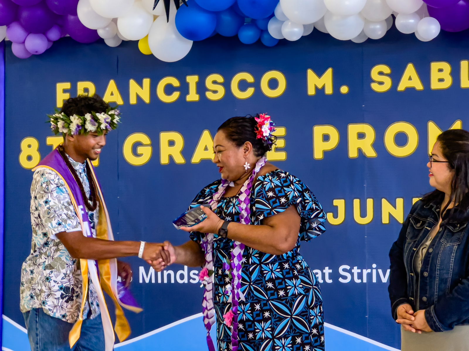 The Excellence in Leadership Award was presented to Dezmon Gabriel Mareham Camacho by FSM Principal Cherlyn Cabera Osung as Vice Principal Catherine A. Cabrera looks on.
