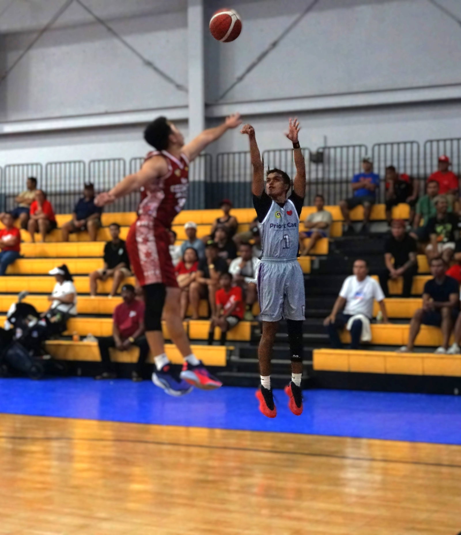 Priority Care's Chioni Dela Cruz takes the contested three-point shot during the championship game against New Changming Market in the open division of the 2025 IT&E-United Filipino Organization Basketball League at the Ada gym on Saturday.Photo by James F. Sablan Jr.