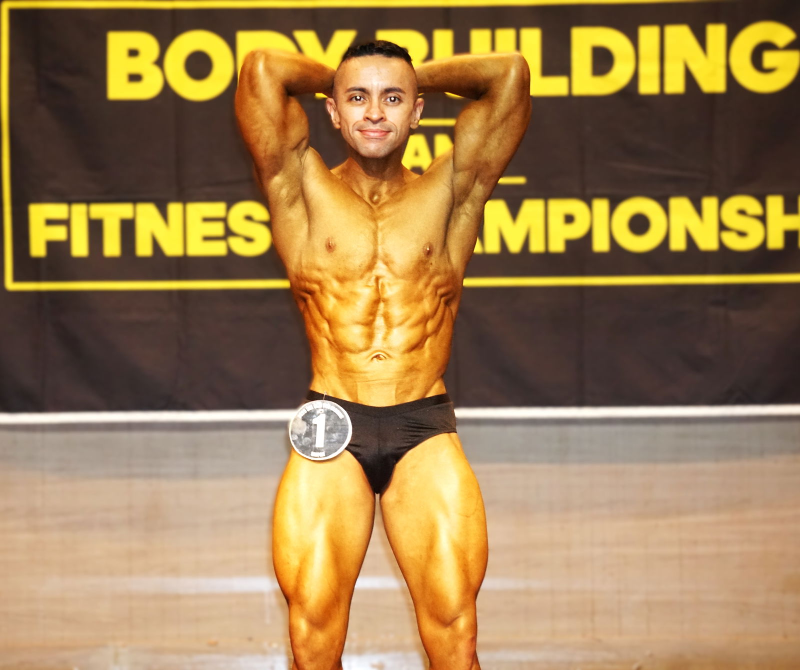 Shawn Fleming displays his abs during the bodybuilding category of the 2025 Dee Clayton Classic & Northern Marianas Bodybuilding Federation competition at Taga Hall, Saipan World Resort, on Saturday.Photo by James F. Sablan Jr.