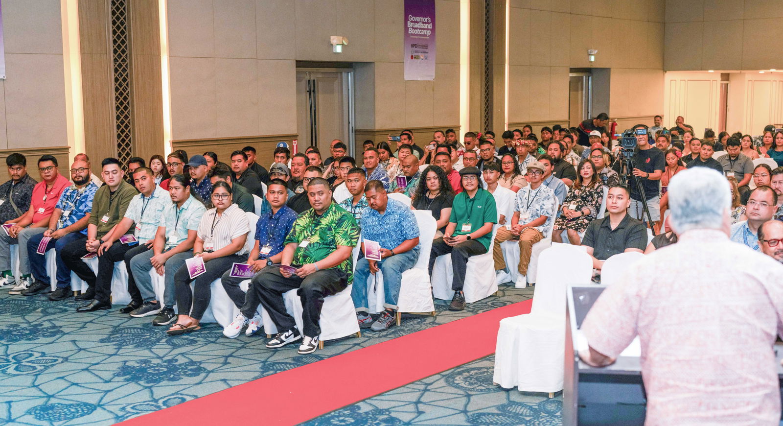 Gov. Arnold I. Palacios congratulates the graduates of the Governor's Broadband Bootcamp.