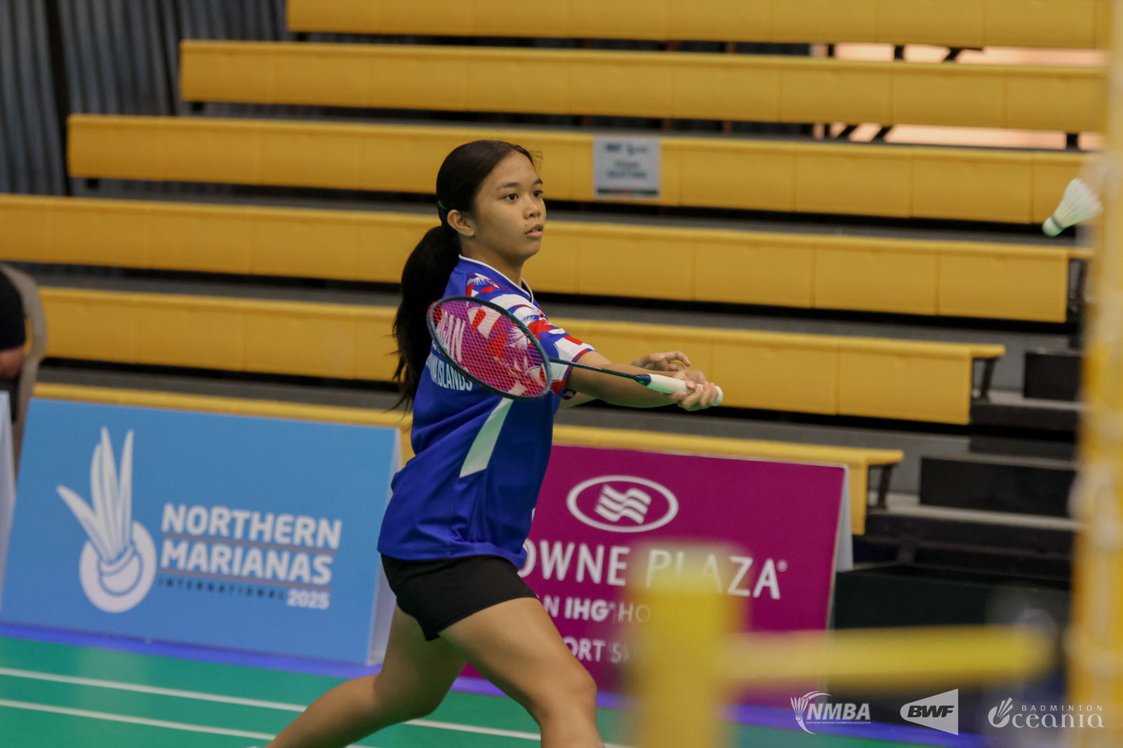 NMI's Genelyn Lansangan extends for the forehand return during a women's singles match of the Northern Marianas International 2025 at the Ada Gym on Tuesday.Northern Marianas Badminton Association photo