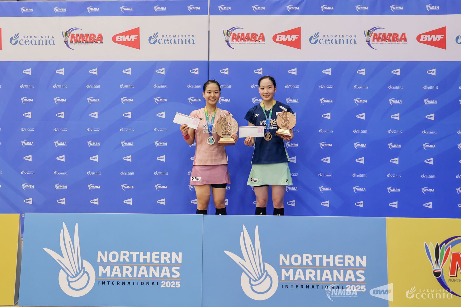 Park Ga Eun, left, poses as the women's singles champion alongside Kim Min Sun as the runner up during the awards ceremony of the Northern Marianas International 2025 held at the Gilbert C. Ada gym on Saturday. Northern Marianas Badminton Association photo