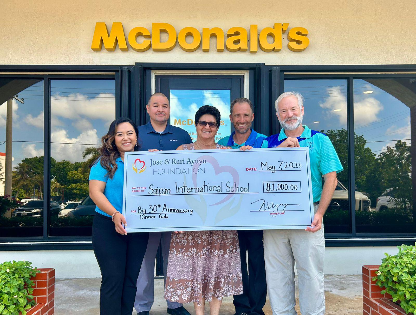 From left, Jose & Ruri Ayuyu Foundation Member Mable A. Glenn, SIS Board Chair Guy Pudney, SIS Business Manager Mili Saiki, incoming SIS Headmaster Martin Jambor, and outgoing SIS Headmaster Ronald E. Snyder.