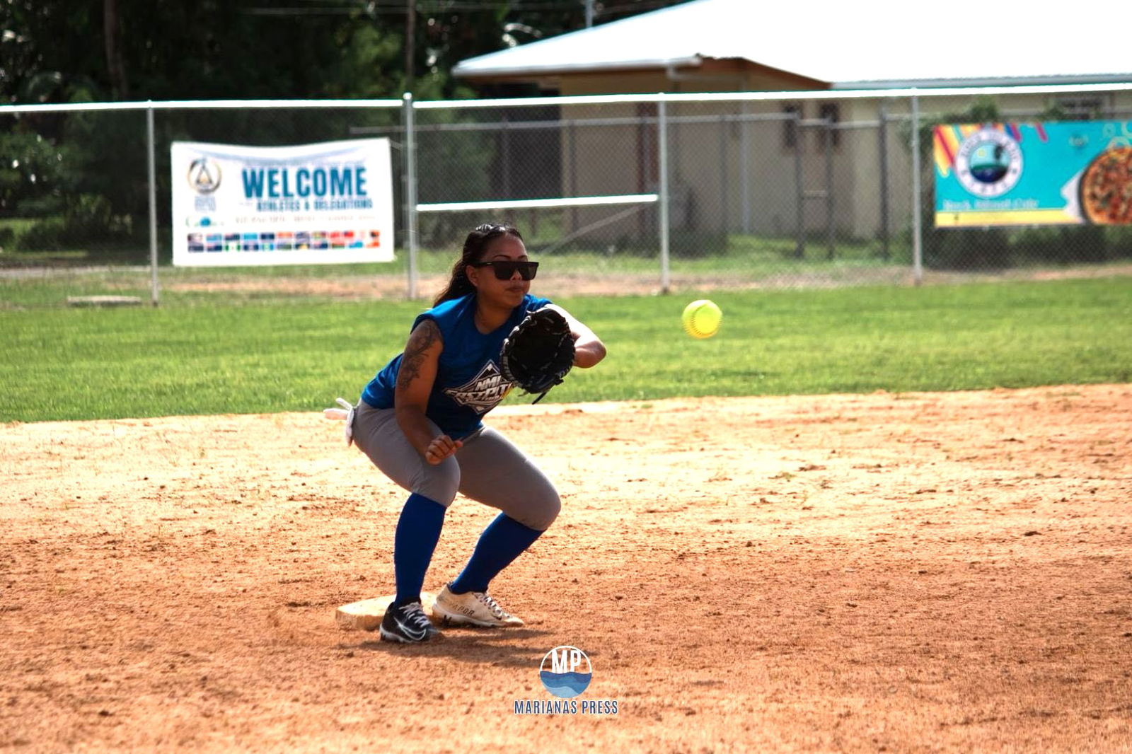 An NMI fastpitch softball player catches the ball from second base during their training in Meyuns Softball Field last Saturday in Palau.Marianas Press via NMSA