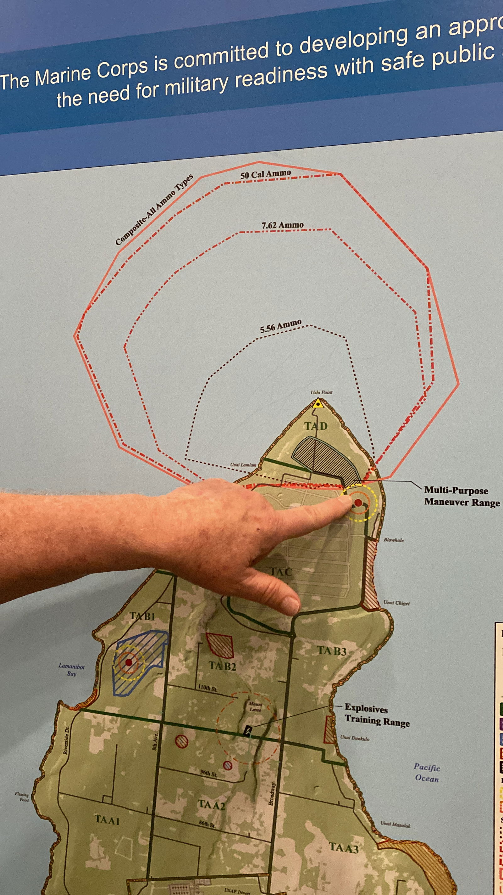 Carlos Hatchcock points out how some of the waters adjacent to Tinian will be closed to boaters and fishermen when live fire training occurs on the island's north portion.
